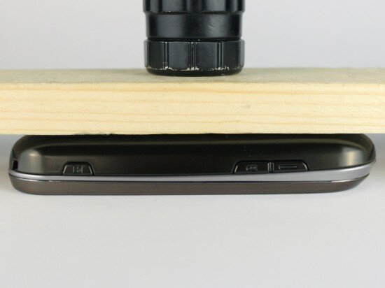 Pic. 5. The phone under the 3 kg (6.6 lbs) wooden bar