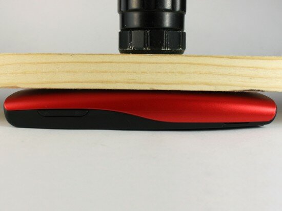 Pic. 5. The phone under the 3 kg (6.6 lbs) wooden bar